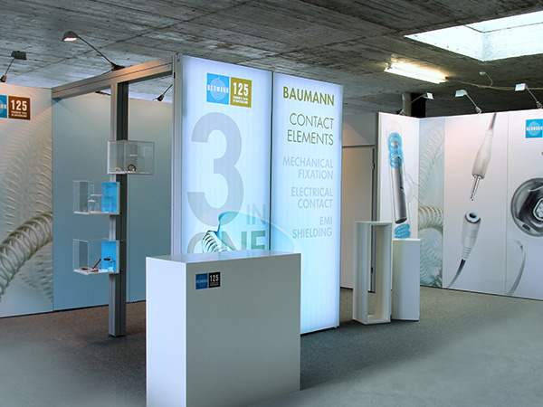 Messestand, Baumann Federn
